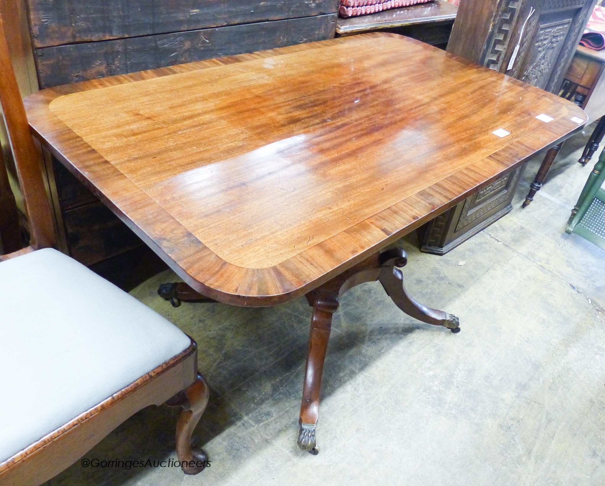A small Regency banded mahogany rectangular tilt top breakfast table, length 120cm, depth 74cm, height 72cm